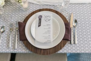 Place setting of white, wood and linens